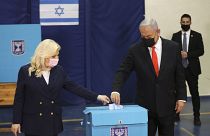 Israeli Prime Minister Benjamin Netanyahu and his wife Sara cast their ballots at a polling station as Israelis vote in a general election, in Jerusalem. March 23, 2021