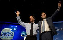 FILE:  Mariano Rajoy, then leader of the Spanish opposition party Partido Popular (PP), waves to supporters next to former PM Jose Maria Aznar, October 6, 2011
