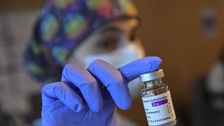 A health worker holds a dose of the AstraZeneca COVID-19 vaccine, during a mass vaccination campaign at Sn Pedro Hospital, in Logrono, northern Spain, Wednesday, March 24.