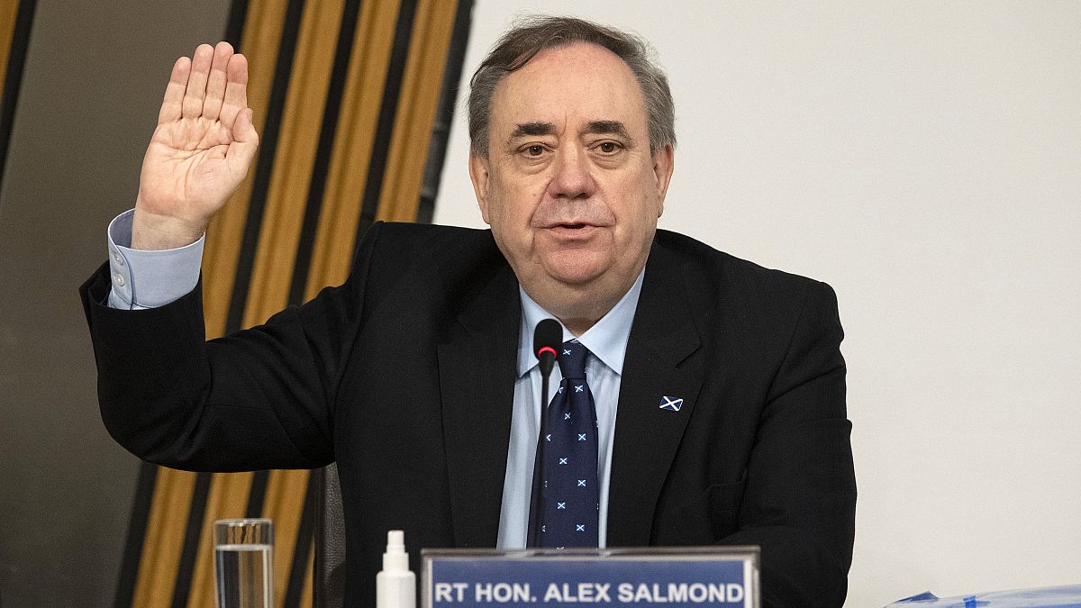 Former Scottish leader Alex Salmond is sworn in before giving evidence to a committee of the Scottish parliament at Holyrood in Edinburgh, Friday Feb. 26, 2021.