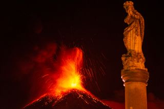 Lava erupts from Mt. Etna volcano during its sixteenth eruption since the volcanic activity started in February. Fornazzo, Sicily, Italy. March 24, 2021