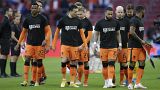 Netherlands' players enters on the field with shirts reading 'Football Supports Change' prior to the start of the World Cup 2022 qualifier vs Latvia on March 27, 2021.