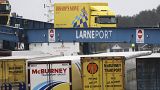 vehicles disembark from a ferry arriving from Scotland at the port of Larne, Northern Ireland Feb. 2, 2021.