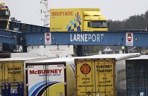 vehicles disembark from a ferry arriving from Scotland at the port of Larne, Northern Ireland Feb. 2, 2021.