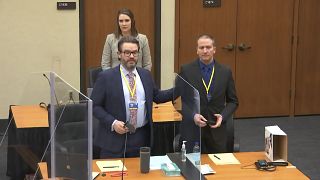 Derek Chauvin (R) with his defense attorney Eric Nelson (L) introduce themselves to potential jurors on March 23, 2021 at the Hennepin County Courthouse in Minneapolis.