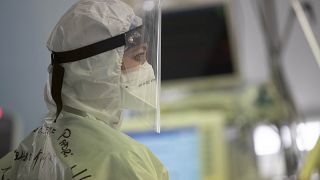 A nurse looks at a monitor in the COVID Intensive Care Unit of the San Filippo Neri hospital in Rome, Friday, March 19, 2021.