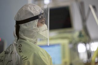 A nurse looks at a monitor in the COVID Intensive Care Unit of the San Filippo Neri hospital in Rome, Friday, March 19, 2021.