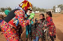 Syrian comedian Firas al-Ahmad dresses up as a clown to entertain children in camps for displaced Syrians