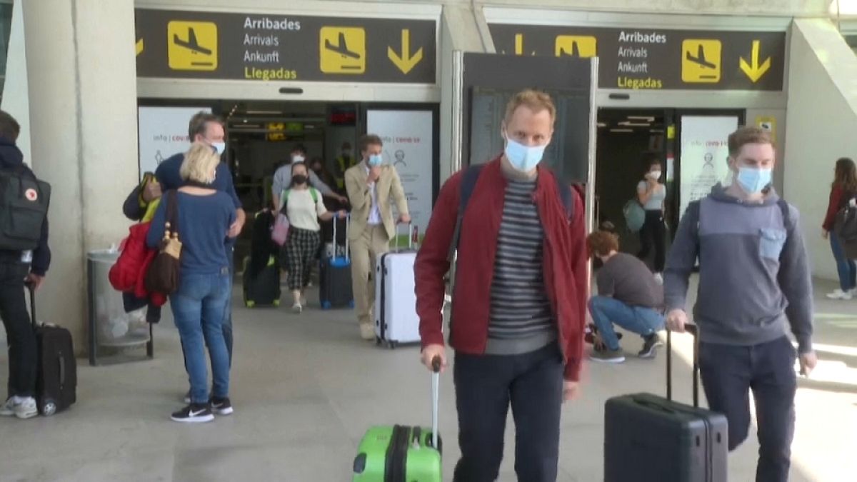 Tourists arrive to Palma de Mallorca airport