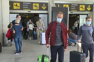 Tourists arrive to Palma de Mallorca airport