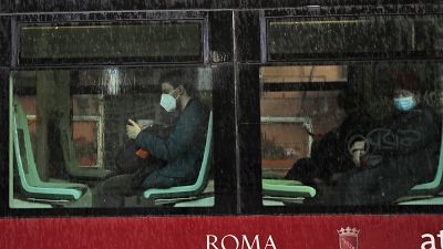People wearing face masks to curb the spread of COVID-19, sit at distance in a tram in downtown Rome, Monday, March 15, 2021. People wearing face masks to curb the spread of COVID-19, sit at distance in a tram in downtown Rome, Monday, March 15, 2021.