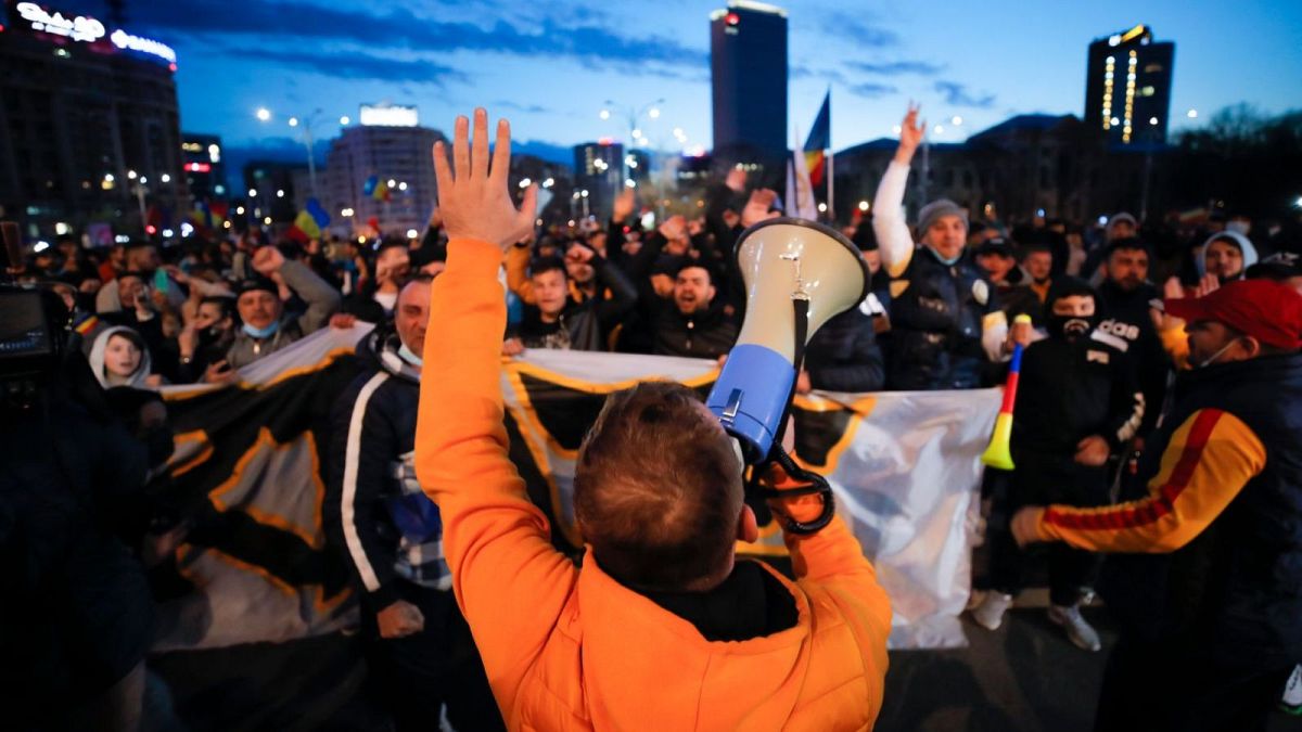 Protestors shouted slogans outside the Romanian government headquarters in Bucharest.