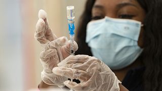 Syringes are loaded with the vaccine on the first day of the Johnson & Johnson vaccine being made available to residents at the Baldwin Hills Crenshaw Plaza in Los Angeles