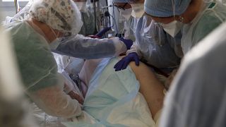 Medical workers tend to a patient affected with the COVID-19 in the Amiens Picardie hospital, March 30, 2021 in Amiens, France.