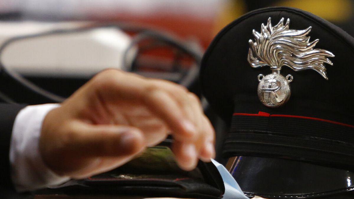 FILE! - The hat of a Carabinieri paramilitary police officer on a table in a courtroom in Rome, July 16, 2020. 