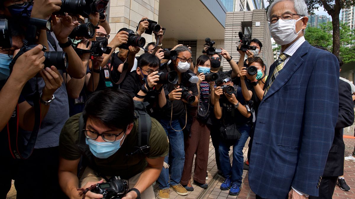 Pro-democracy lawmaker Martin Lee, right, arrives at a court in Hong Kong Thursday, April 1, 2021.