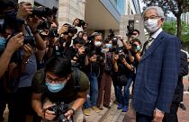 Pro-democracy lawmaker Martin Lee, right, arrives at a court in Hong Kong Thursday, April 1, 2021.