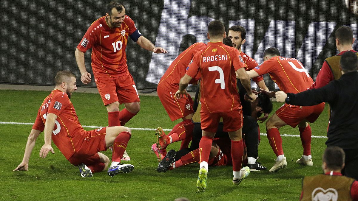 North Macedonia's Eljif Elmas, not seen in the frame, celebrates with his teammates after scoring his side's second goal during the group J qualifying game agaist Germany
