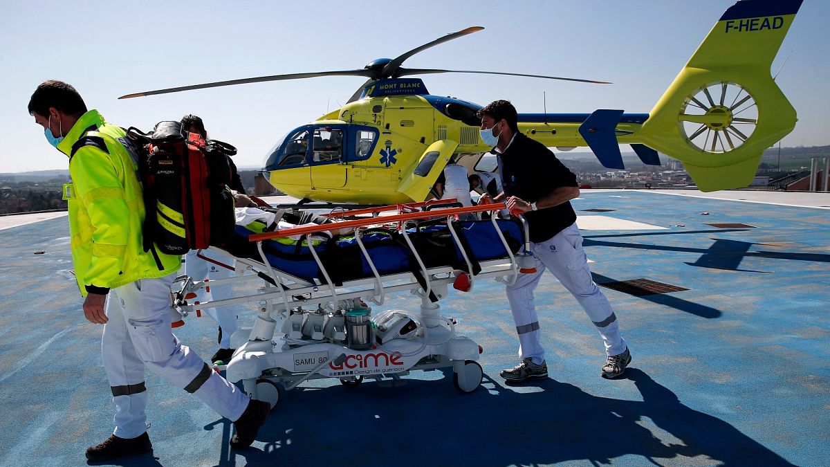 Medical workers bring an emergency arrival on the rooftop of the Amiens Picardie hospital, March 30, 2021 in Amiens, France.