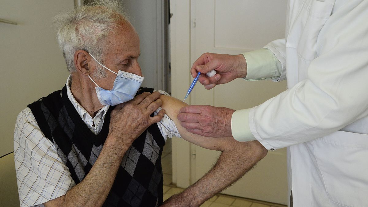 A doctor vaccinates a patient with the second dose of COVID-19 vaccine produced by Chinese Sinopharm in Taplanszentkereszt, Hungary, April 1, 2021