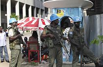 FILE: UN forces stand guard on a street in Abidjan, Ivory Coast, Dec. 22, 2010.