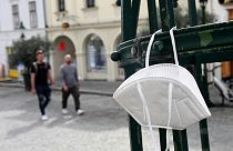 A discarded FFP2 face mask hangs on a grid in Eisenstadt, Austria