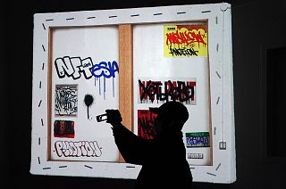 A man views artwrok at the Superchief Gallery NFT, a physical gallery dedicated exclusively to NFT (non-fungible tokens) artwork in New York.