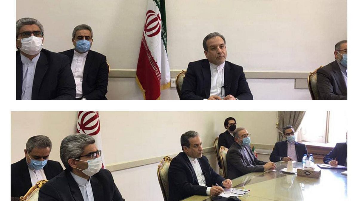 This combined photo from Iran's Foreign Ministry shows Iranian diplomats on a virtual talk on nuclear deal with representatives of world powers, in Tehran, April 2, 2021