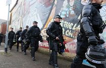 FILE: Riot police leave the area after policing a parade by the unionist Orange Order at the Ardoyne shops on the Crumlin Road in north Belfast on October 1, 2016.