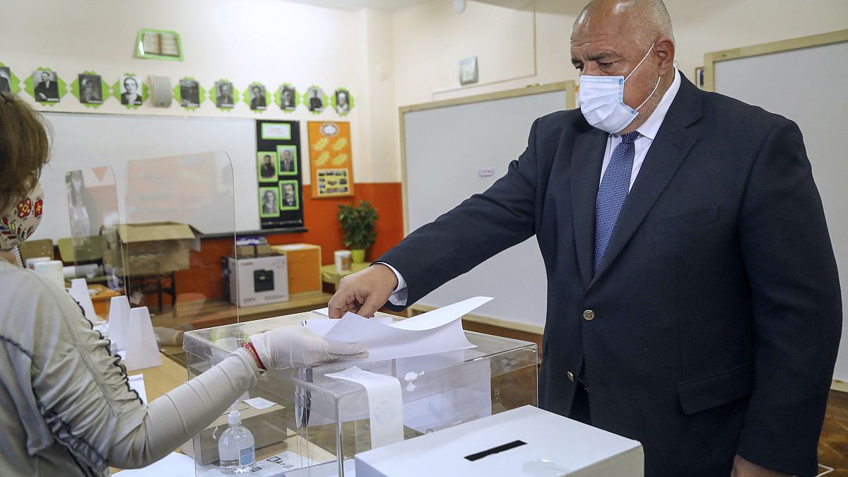 Bulgarian Prime Minister Boyko Borissov casts his ballot during parliamentary elections in the town of Bankya, Bulgaria, Sunday, April 4, 2021.