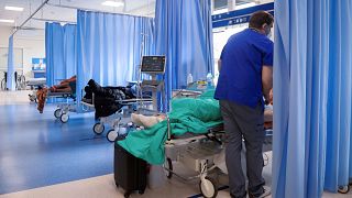 A nurse attends to patients with respiratory problems at the emergency ward of the hospital in Bochnia, Poland, Sunday, April 4, 2021.