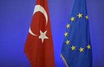 An archive image of  the Turkish national flag and the EU flag