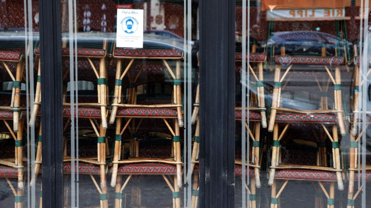 FILE: Chairs are stacked inside the famous Cafe de Flore closed along with all cafes and restaurants, Paris, France, March 15, 2021 