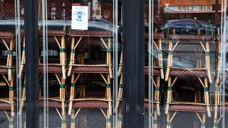 FILE: Chairs are stacked inside the famous Cafe de Flore closed along with all cafes and restaurants, Paris, France, March 15, 2021