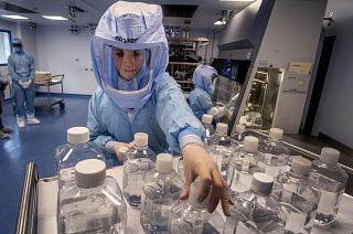 A laboratory worker simulates the workflow in a cleanroom of the BioNTech vaccine production in Marburg, Germany, during a media day on Saturday, March 27, 2021.