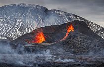 Steam and lava spurt from a new fissure on a volcano on the Reykjanes Peninsula in southwestern Iceland, Monday, April 5, 2021.