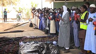 Senegalese Muslim volunteers bury unidentified dead