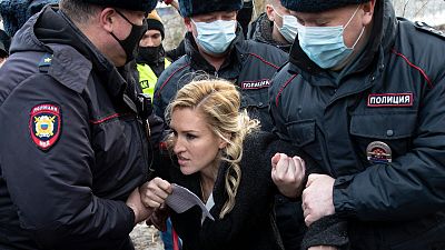 Police officers detain the Alliance of Doctors union's leader Anastasia Vasilyeva at the prison colony IK-2