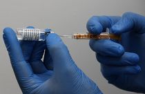 FILE: A doctor prepares the AstraZeneca vaccine at a Pharmacy in Edgeware, London, Tuesday, March 16, 2021.
