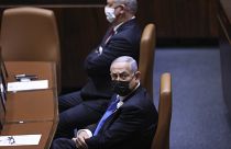 Israeli Prime Minister Benjamin Netanyahu, front, attends the swearing-in ceremony for Israel's 24th government at the Knesset in Jerusalem, Tuesday, April 6, 2021.