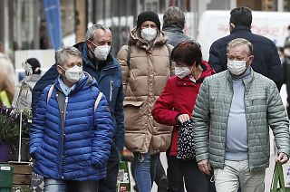 People wear face masks at a shopping street in Gelsenkirchen, Germany, Tuesday, April 6, 2021.