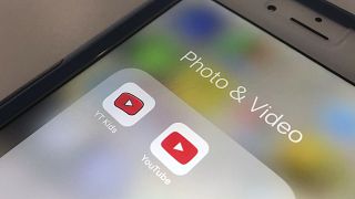 This April 25, 2018 file photo, the YouTube app and YouTube Kids app are displayed on an iPhone in New York.