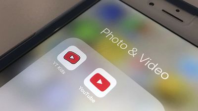 This April 25, 2018 file photo, the YouTube app and YouTube Kids app are displayed on an iPhone in New York.
