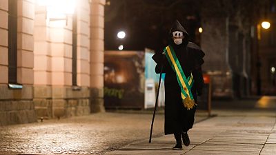 'Grim reaper' artist in Berlin protests Brazil virus stance