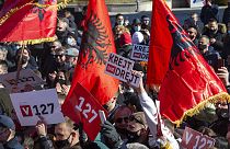 Supporter of VETEVENDOSJE (Self-Determination) political party holds a slogan reading in Albanian " All and Straight" during the closing electoral rally in capital Pristina.