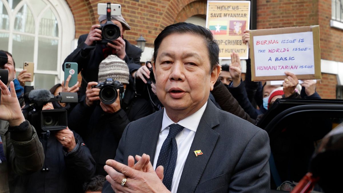 Kyaw Zwar Minn, the Myanmar's ambassador in London stands outside the Myanmar Embassy whilst a statement is read on his behalf in London, Thursday, April 8, 2021.