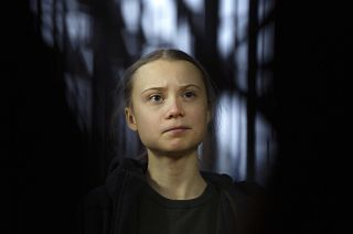 Swedish climate activist Greta Thunberg speaks with the media as she arrives for a meeting of the Environment Council at the European Council building in Brussels, March 2020.