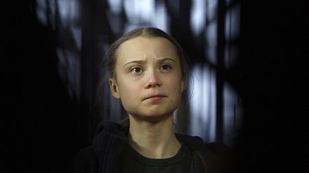 Swedish climate activist Greta Thunberg speaks with the media as she arrives for a meeting of the Environment Council at the European Council building in Brussels, March 2020.