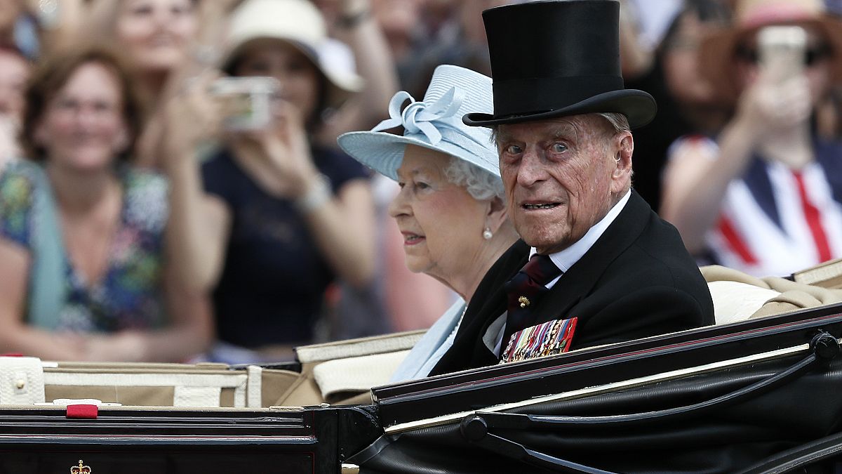 Britain's Queen Elizabeth II and Prince Philip, the Duke of Edinburgh return to Buckingham Palace in a carriage, in London, June 17, 2017.