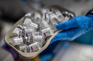 A nurse holds vials of AstraZeneca vaccine against COVID-19 during a vaccination campaign at WiZink indoor arena in Madrid, Spain, April 9, 2021.